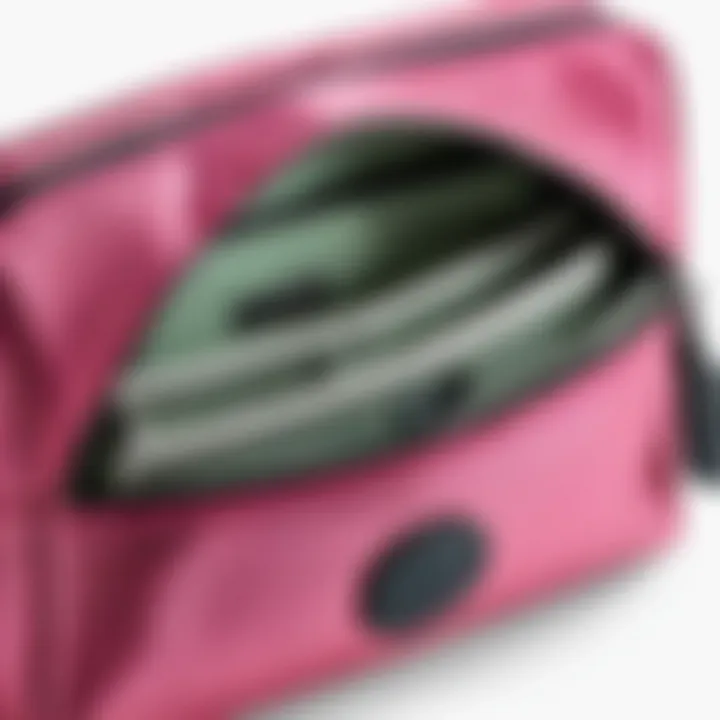 Interior view of a Kipling cosmetic pouch displaying organizational compartments