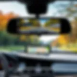 A modern rear view mirror monitor displaying a clear backup camera feed.