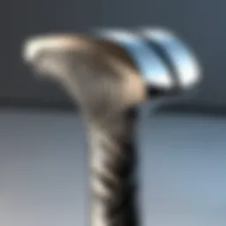 Close-up view of the Dalluge titanium hammer handle showcasing its unique grain and finish.