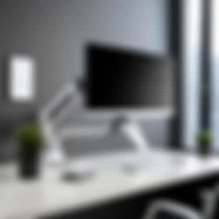 Installation setup of the Ergotron LX monitor arm on a desk, demonstrating ease of assembly.
