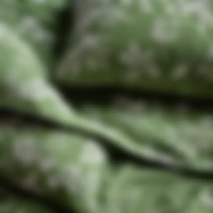 Close-up of the texture and fabric of sage green floral bedding