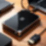 A sleek WD portable hard drive on a desk with a laptop