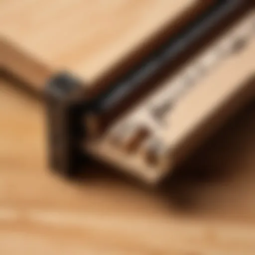 Different types of wood bed frame connectors displayed on a wooden surface