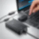 Portable charger connected to a Dell laptop