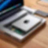 An external optical drive connected to a MacBook Pro