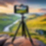 A versatile tripod set up with an iPhone capturing a scenic landscape