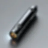 Close-up of a sleek penlight keychain showcasing its compact design.