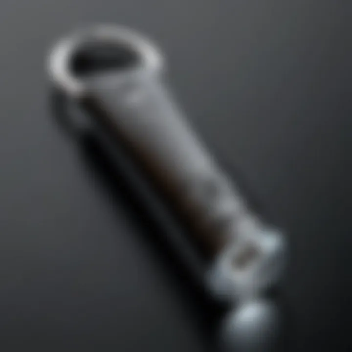 An individual using a penlight keychain for personal safety.